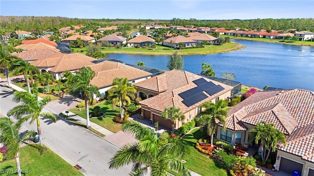 aerial view featuring a residential view and a water view