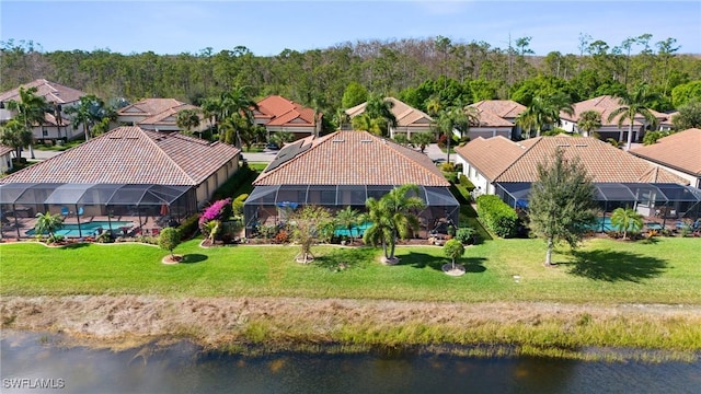 bird's eye view with a residential view and a water view