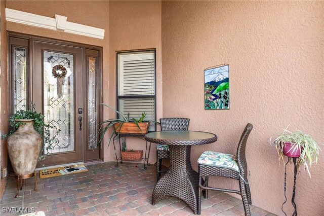 11035 Longwing Dr, Fort Myers, FL 33912 - property entrance featuring stucco siding