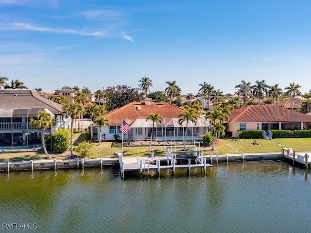 dock area featuring a yard and a water view