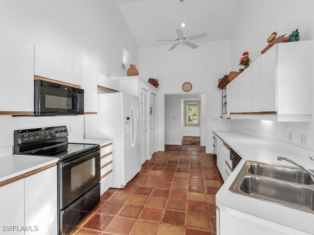 kitchen featuring sink, high vaulted ceiling, black appliances, and white cabinets