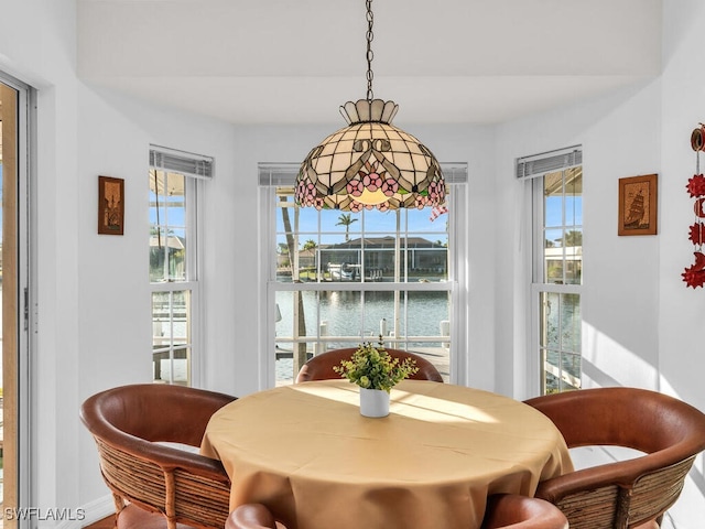 dining room with a water view