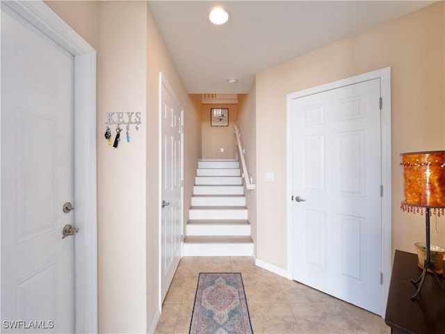 corridor with light tile patterned flooring