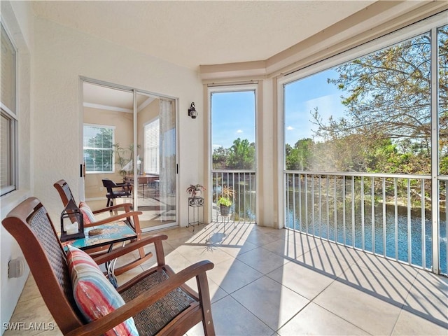 sunroom with a water view