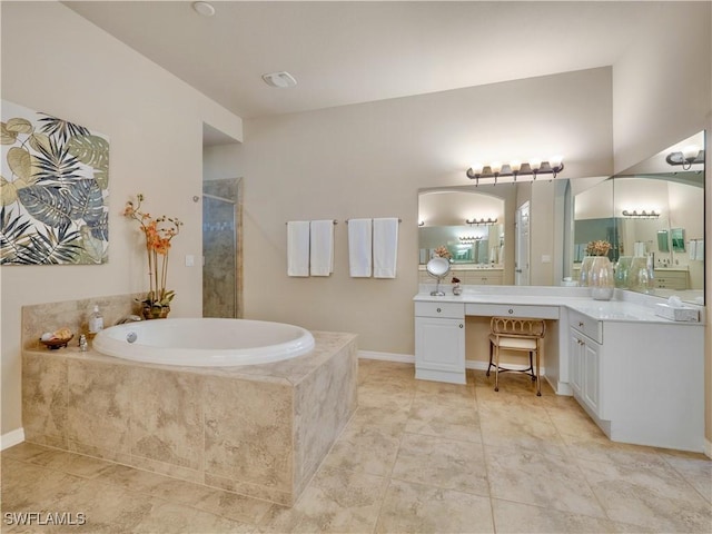 bathroom featuring tile patterned floors, vanity, and separate shower and tub