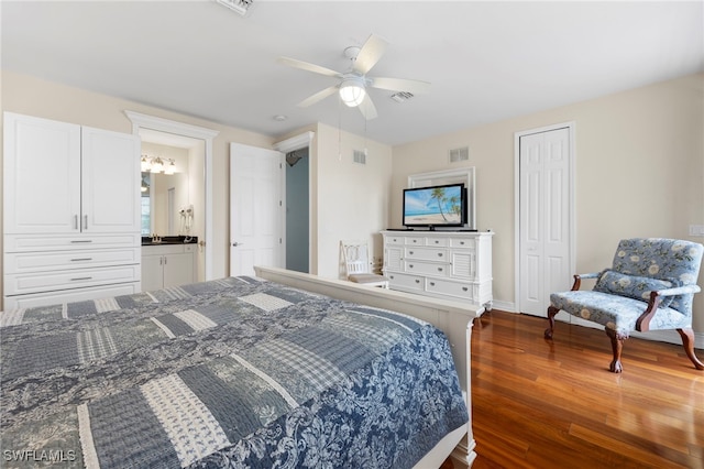 bedroom with a closet, dark hardwood / wood-style floors, and ceiling fan