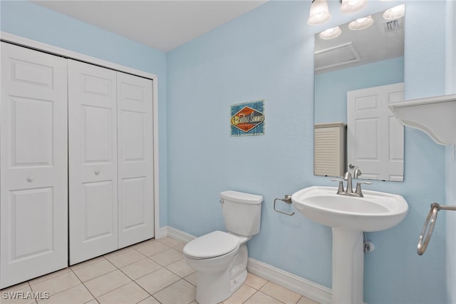 bathroom with tile patterned flooring and toilet