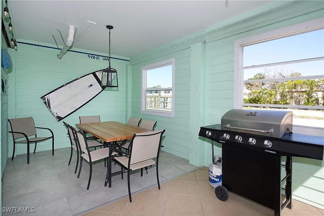 dining space with light tile patterned floors