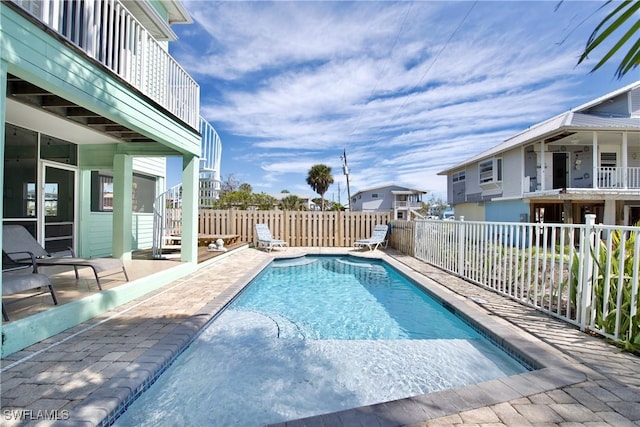 view of pool with a fenced in pool, a fenced backyard, and a patio