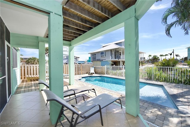 view of swimming pool with a patio area