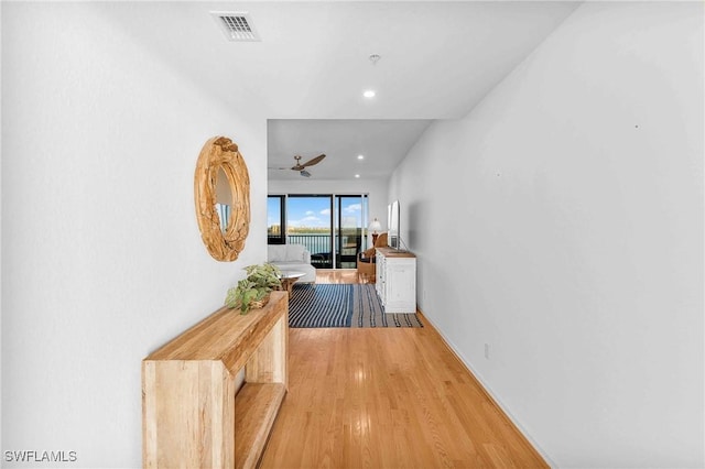 corridor featuring light hardwood / wood-style flooring