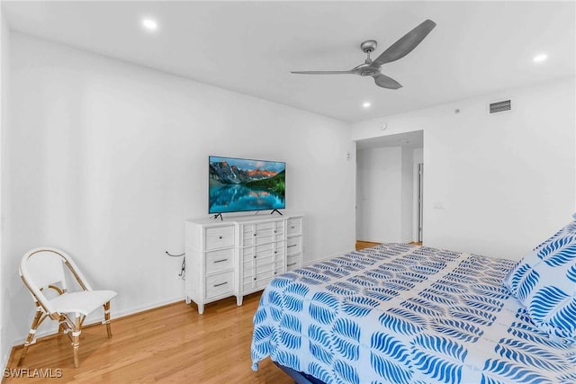 bedroom with ceiling fan and light wood-type flooring