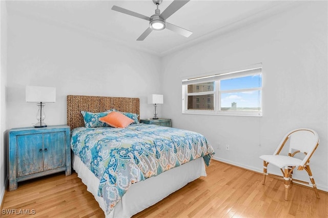 bedroom featuring ceiling fan and hardwood / wood-style floors