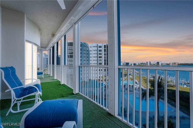 view of balcony at dusk