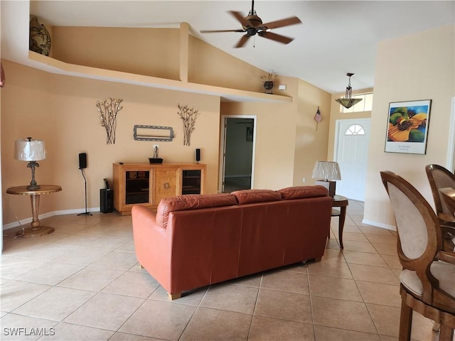 tiled living room with high vaulted ceiling and ceiling fan