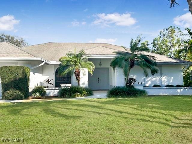 single story home featuring a front yard