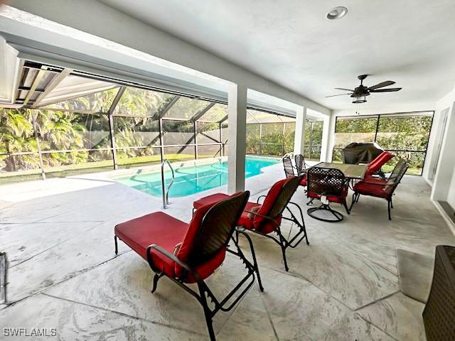 exterior space with ceiling fan and a lanai