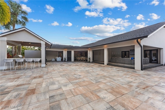 view of patio with exterior bar