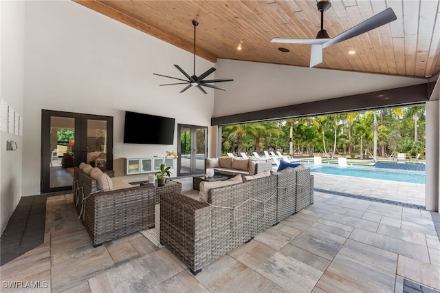 view of patio with outdoor lounge area and ceiling fan