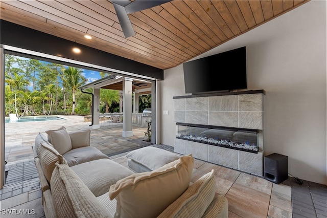 view of patio with an outdoor living space and ceiling fan