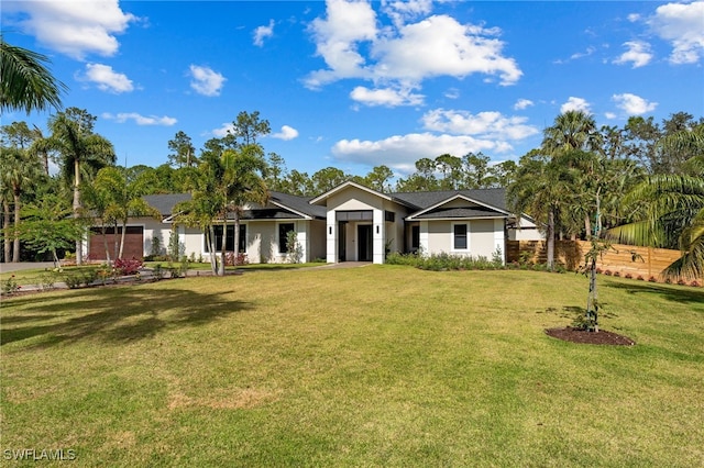 single story home featuring a front yard