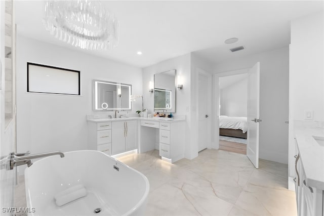 bathroom with vanity and a bathtub