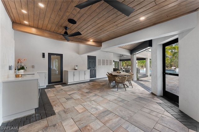 interior space with sink and ceiling fan