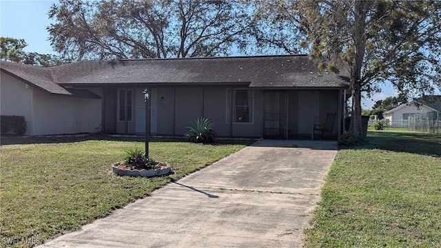 ranch-style home with a front lawn