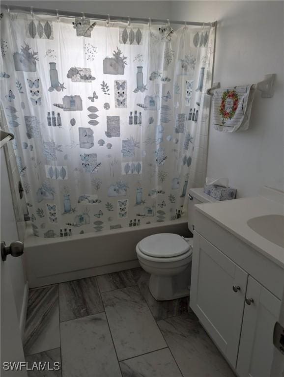 full bathroom featuring shower / tub combo with curtain, vanity, and toilet