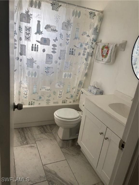 full bathroom featuring vanity, toilet, and shower / tub combo with curtain