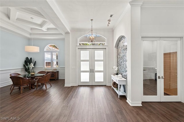 3747 Fountainhead Ln, Naples, FL 34103 - foyer with french doors, ornamental molding, wood finished floors, beam ceiling, and a chandelier