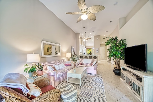 tiled living room featuring ceiling fan