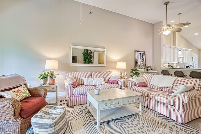 living room with high vaulted ceiling and ceiling fan