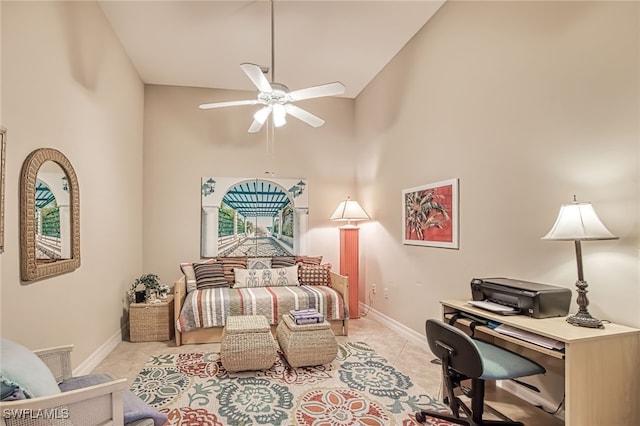 tiled bedroom featuring a high ceiling