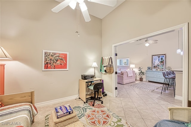 tiled living room with ceiling fan and high vaulted ceiling