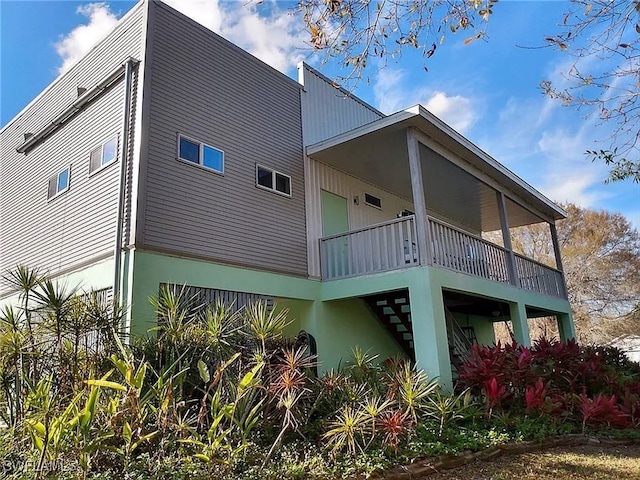 rear view of house with a balcony