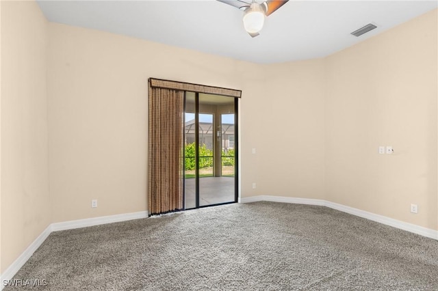 carpeted empty room featuring ceiling fan