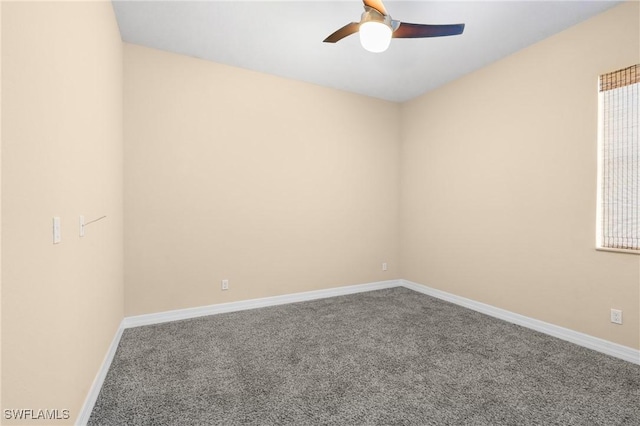 spare room featuring ceiling fan and carpet flooring