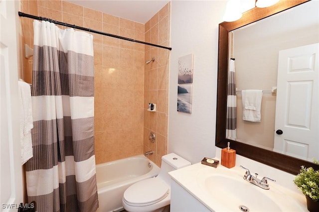full bathroom featuring shower / bath combination with curtain, vanity, and toilet