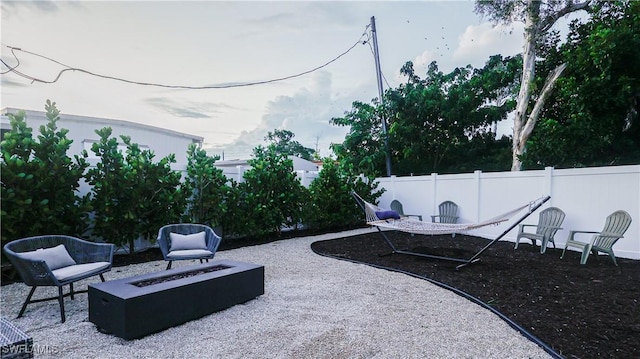 view of patio / terrace featuring fence and an outdoor fire pit