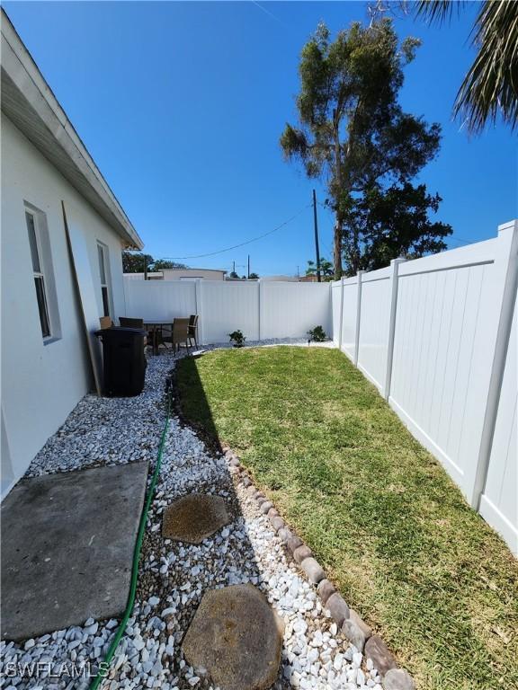 view of yard featuring a patio and a fenced backyard