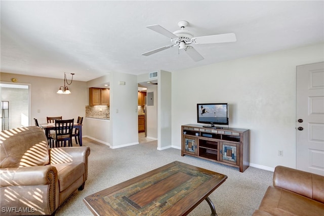 carpeted living room featuring ceiling fan