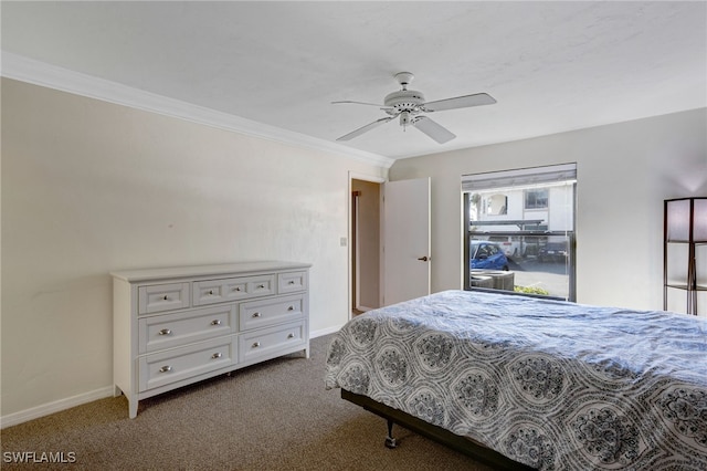 carpeted bedroom featuring crown molding and ceiling fan