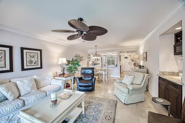 living room with crown molding and ceiling fan