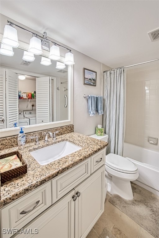 full bathroom featuring vanity, toilet, separate washer and dryer, and shower / bath combo with shower curtain