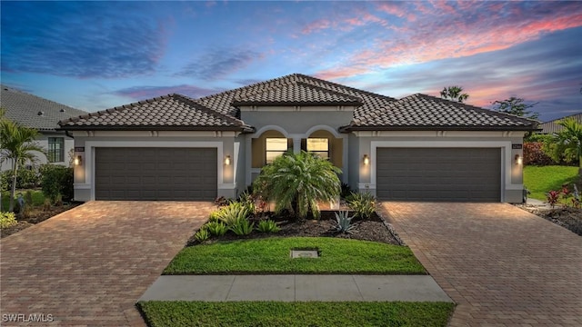 mediterranean / spanish-style house featuring a garage