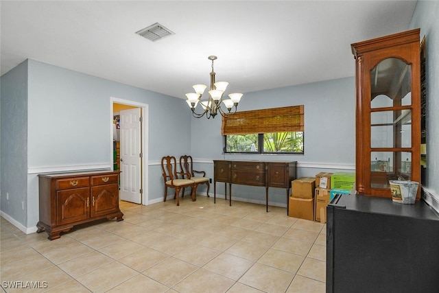 sitting room with a chandelier, visible vents, baseboards, and light tile patterned floors