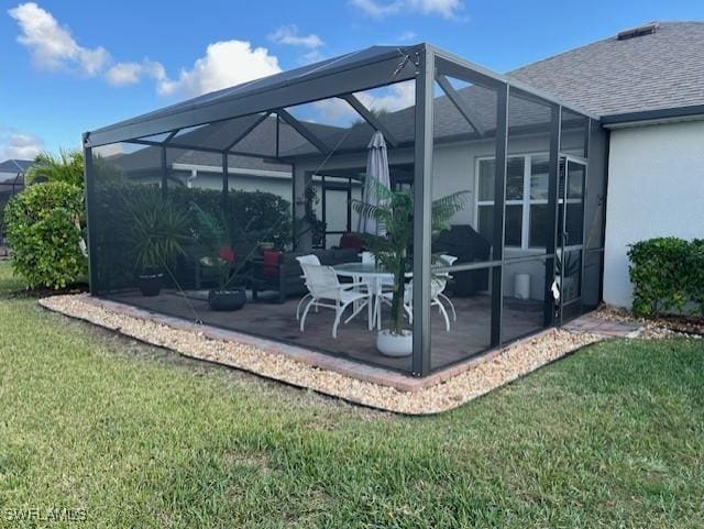 view of patio / terrace with a lanai