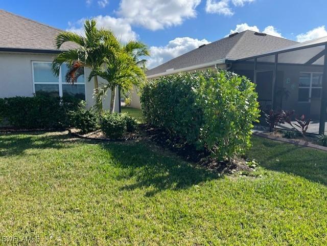 view of yard featuring a lanai