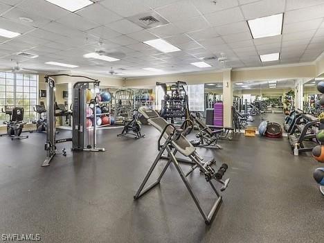 workout area featuring a drop ceiling